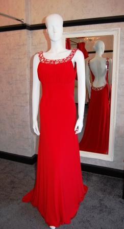 Image 1 of Red jersey fitted prom dress.