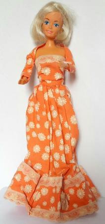 Image 1 of 1990,s DOLL by LUCKY in ORANGE DRESS 30 cm tall