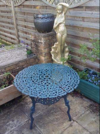 Image 5 of Heavy cast iron garden table with bench and two chairs
