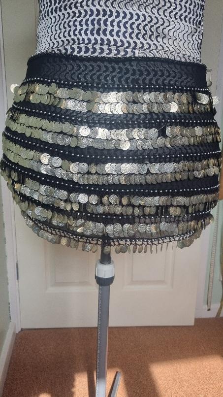 Preview of the first image of Belly dance hip scarf. Full of jingling coins..