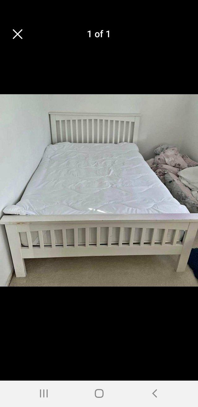 Preview of the first image of Marks and Spencer wooden double bed frame.