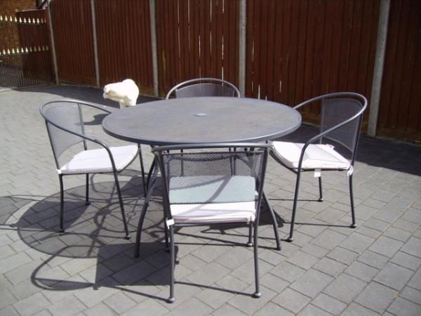 Image 2 of Grey metal garden table & 4 chairs with pads