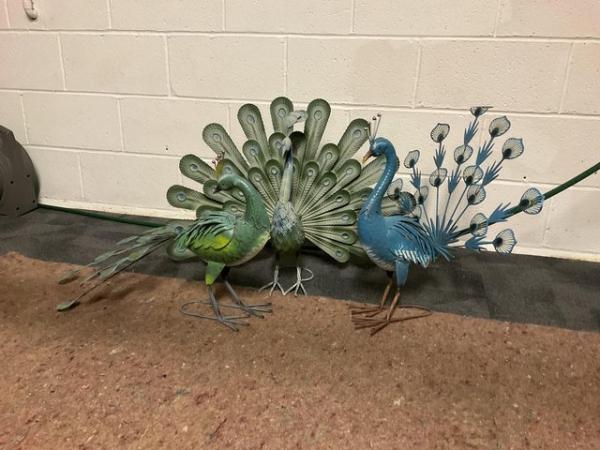 Image 1 of Three,  Metal , peacocks.