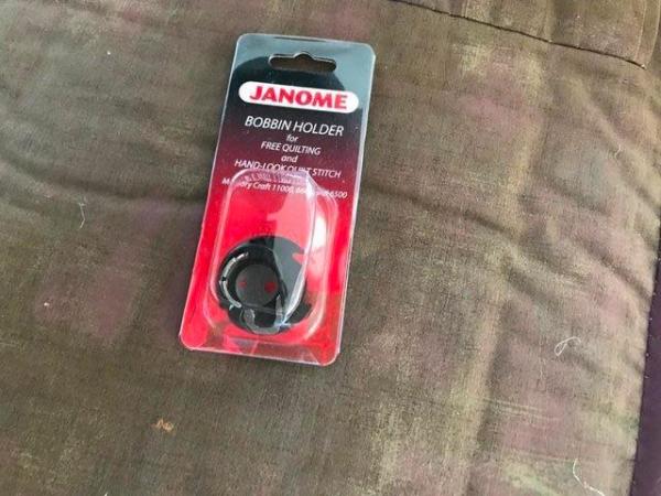 Image 1 of JANOME Special Blue Dot Bobbin. New in original packaging.