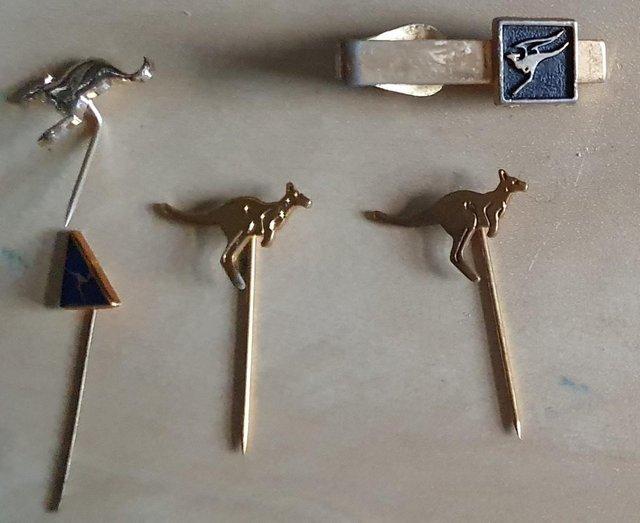 Preview of the first image of Five Qantas pins - airline memorabilia.