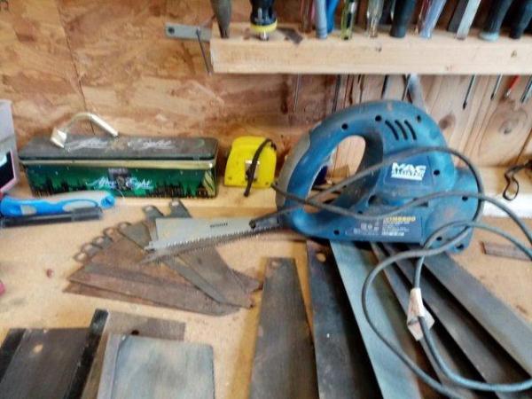Image 1 of NINE HANDSAWS PLUS ONE ELECTRIC