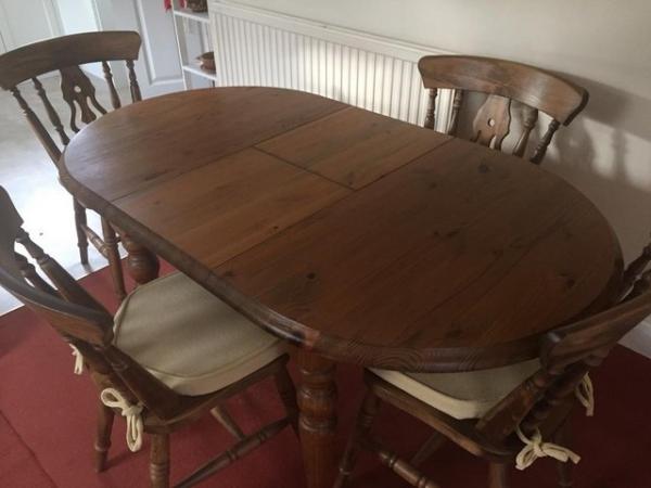 Image 1 of Dark stained Pine Extending Table and 4 Chairs
