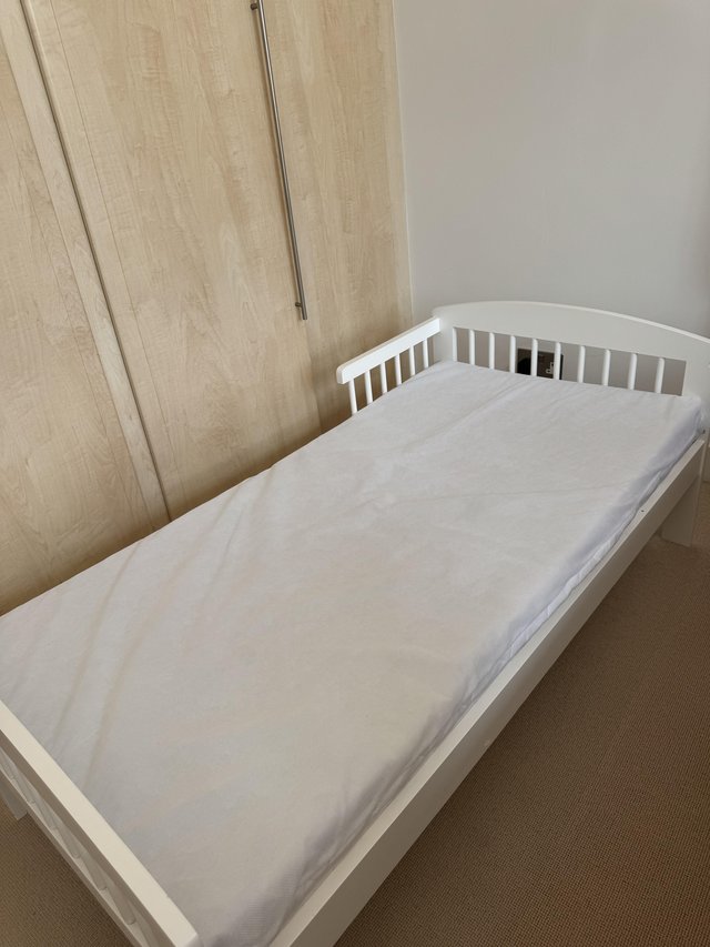 Preview of the first image of Wooden bed with mattress for toddler from Amazon.
