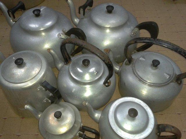 Preview of the first image of 7 x Old canteen teapots Kitchenalia film props,9pt, 7pt, 4pt.