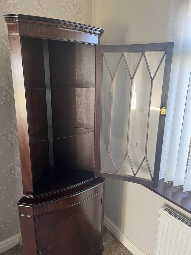 Preview of the first image of Mahogany corner unit with glass cabinet and lock doors.