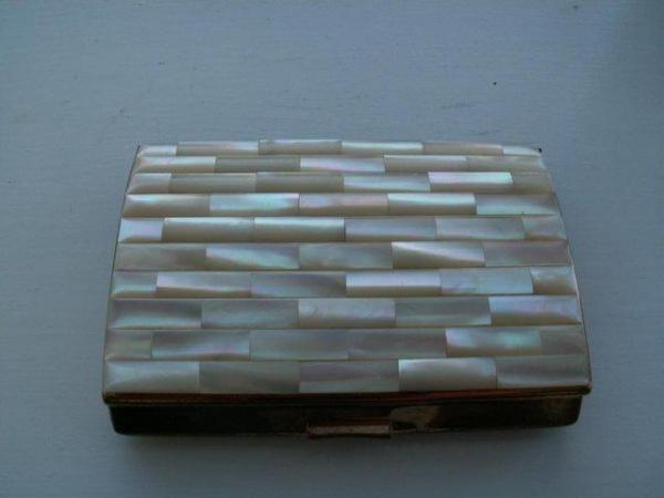 Image 1 of cigarette case.  mother of pearl style lid. circa 1960
