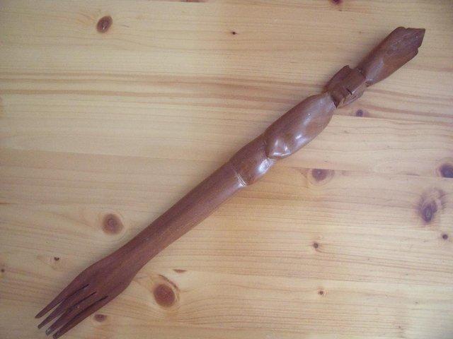 Preview of the first image of Long vintage hand carved wooden fork/tribal figure handle..