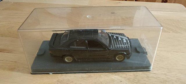 Preview of the first image of cased mercedes 190 toy car with free postage.
