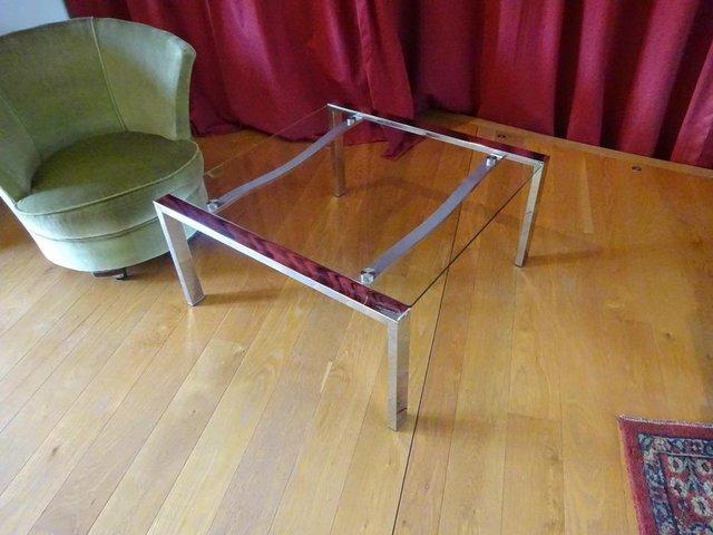 Preview of the first image of GLASS AND CHROME COFFEE TABLE.