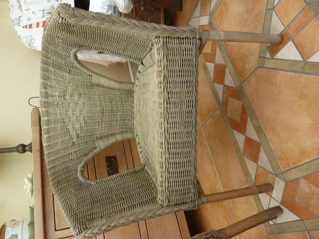 Preview of the first image of 2 green wicker chairs for sale.