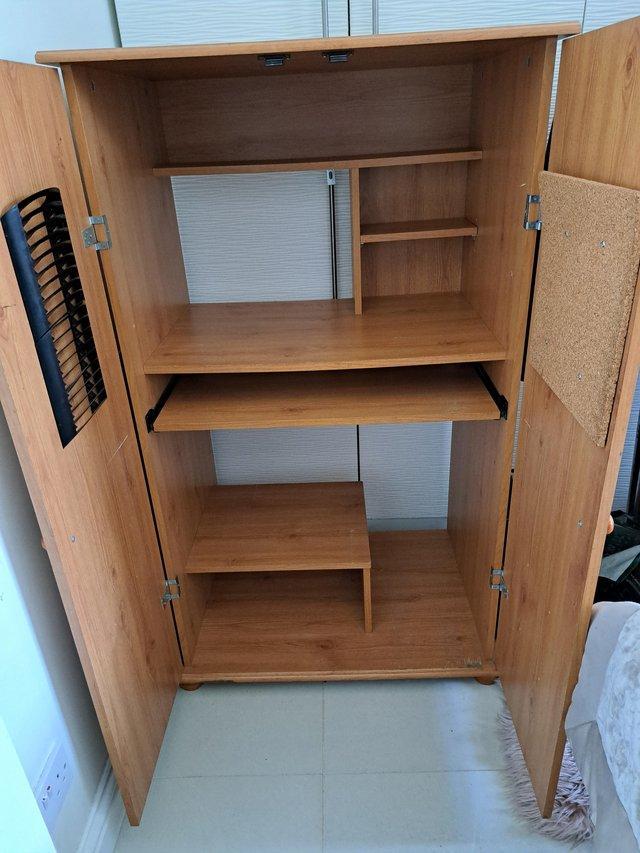 Preview of the first image of computer cabinet with storage.