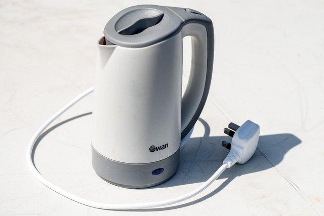 Preview of the first image of Swan Dual Voltage Travel Kettle.