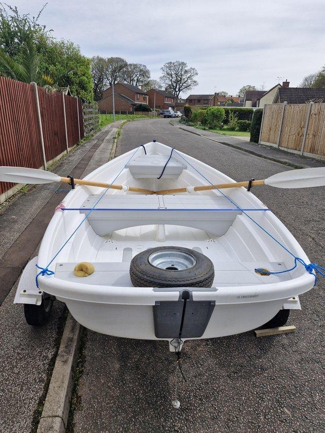 Preview of the first image of Walker bay 10ft dinghy with electric outboard and trailer.