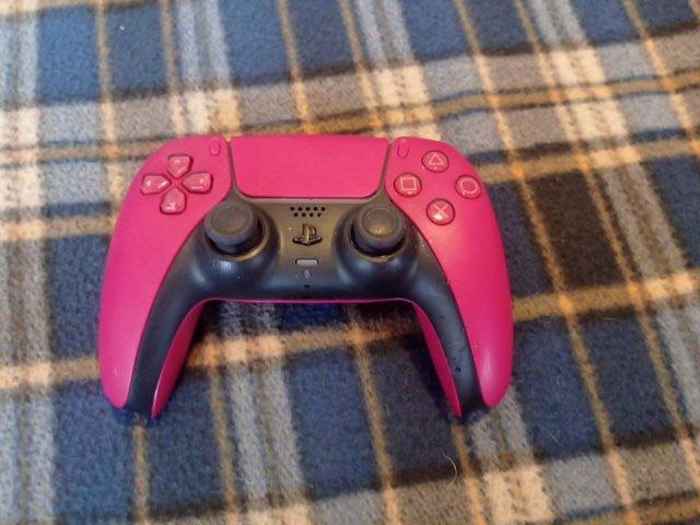 Preview of the first image of Sony DualSense PS5 Wireless Controller - Cosmic Red.
