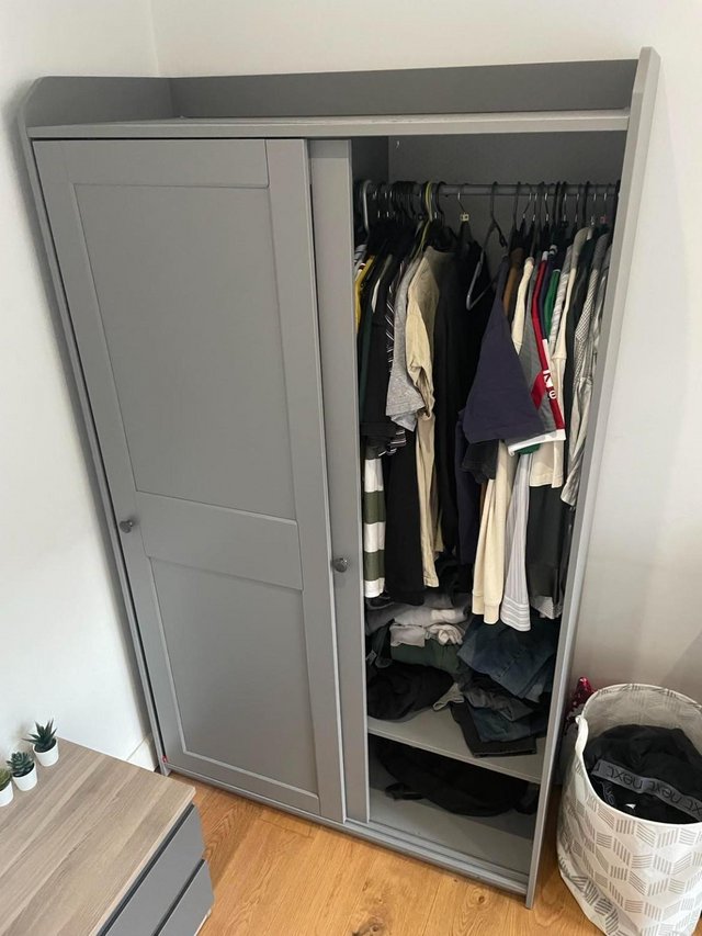 Preview of the first image of IKEA HAUGA Wardrobe with sliding doors.