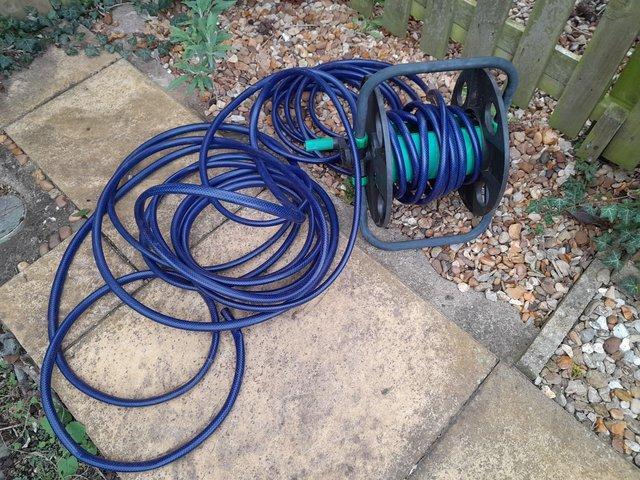 Preview of the first image of 15 m Garden hose and reel, all good order.