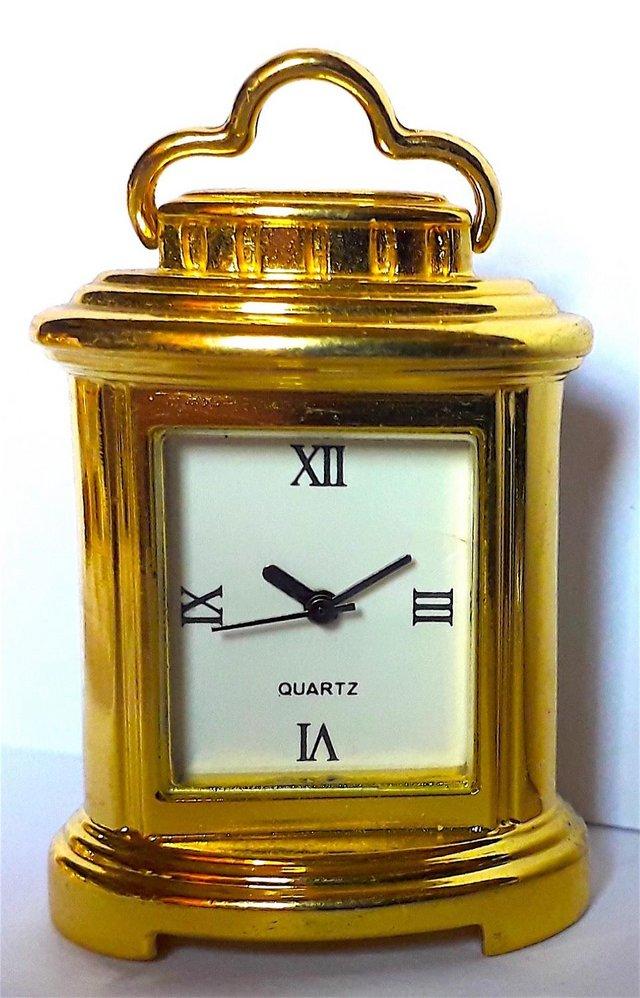 Preview of the first image of MINIATURE NOVELTY CLOCK - A HANDLED MANTLE.