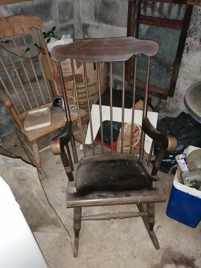 Preview of the first image of Vintage antique dark wood rocking chair.