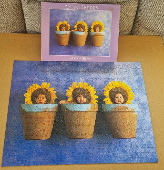 Preview of the first image of 1000 piece jigsaw by ANNE GEDDES called SUNFLOWER TRIO..