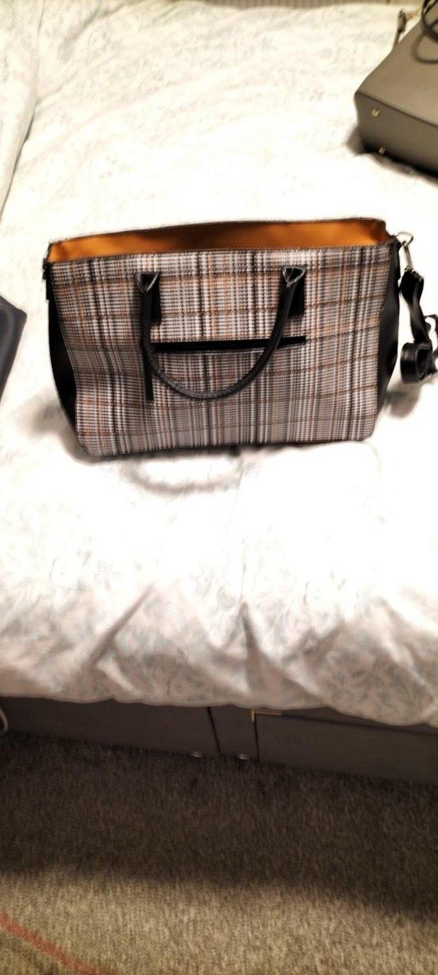 Preview of the first image of Large ladies handbag (New with tags).