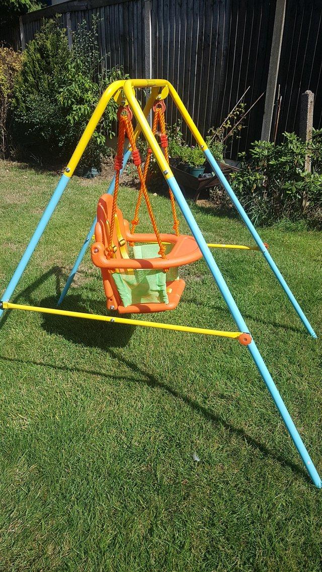 Preview of the first image of Toddler swingnearly new with adjustable saftey harness.