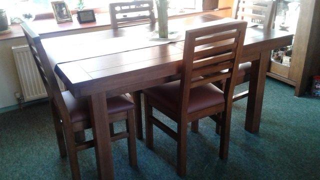 Image 1 of Oak dining table and 4 chairs includes matching coffee table