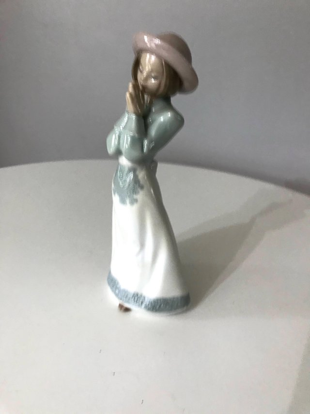 Preview of the first image of Lladro Please Please Girl Figurine.