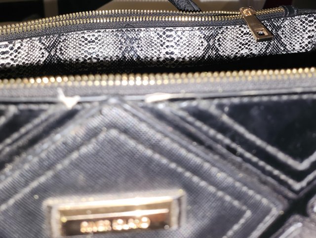 Preview of the first image of River island handbag black with a couple of scuffs.