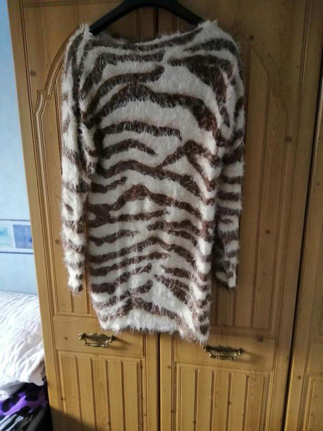 Preview of the first image of New Tiger Print Fluffy Jumper Size 10/12.