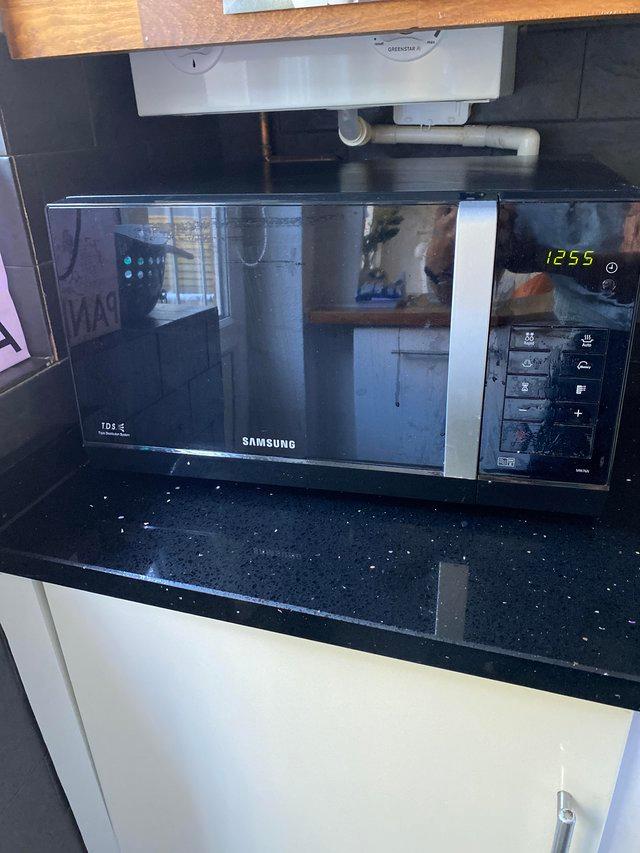 Preview of the first image of Samsung microwave . Black in very good condition..