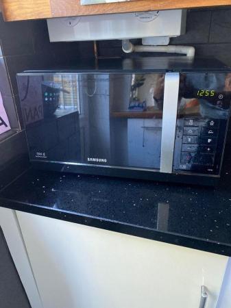 Image 1 of Samsung microwave . Black in very good condition.