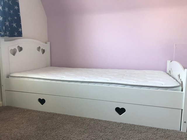 Preview of the first image of Single wooden bed with heart design.