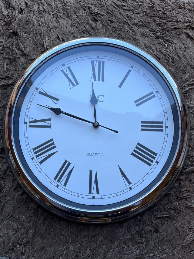 Preview of the first image of Large silver / chrome wall clock.