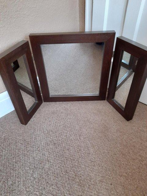 Preview of the first image of Dark brown wood dressing table mirror.