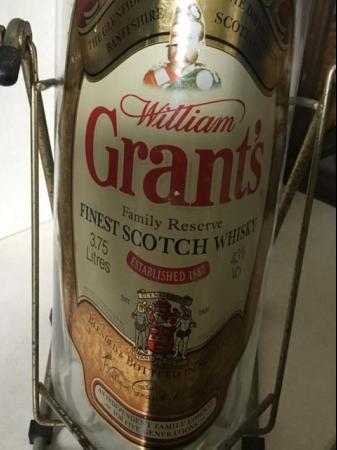 Image 1 of Grants Whisky Bottle in Stand.