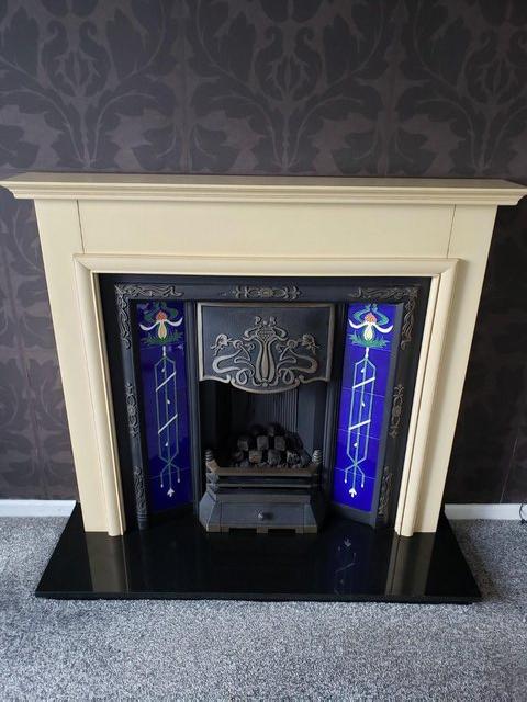 Preview of the first image of Cast iron tiled fire surround and granite hearth.