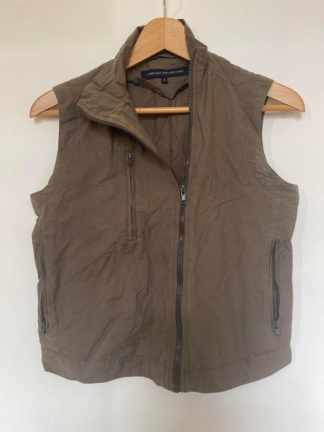 Preview of the first image of French Connection green/brown zipped gilet.