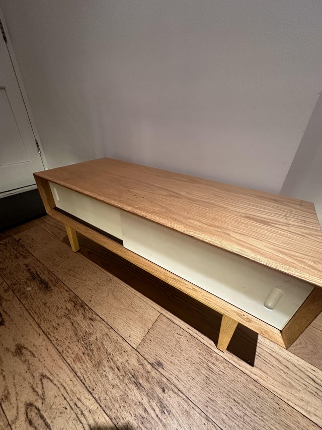 Preview of the first image of Modern  Tv unit with oak wood with White slide doors..