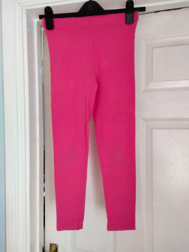 Preview of the first image of Girls Dark Pink Leggings Size 10/11.