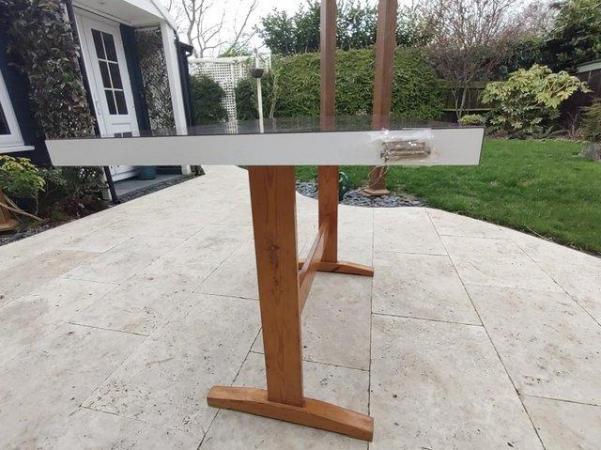 Image 2 of Formica Table with pine pedestal legs.