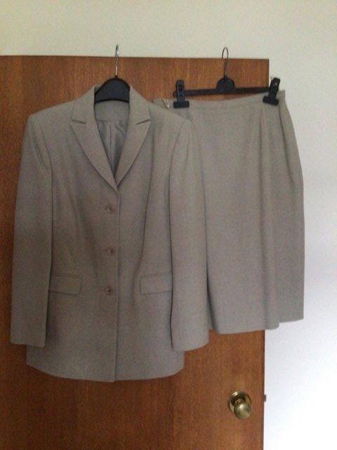 Preview of the first image of Beige two piece skirt suit size 12..