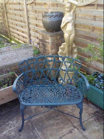 Image 2 of Heavy cast iron garden table with bench and two chairs