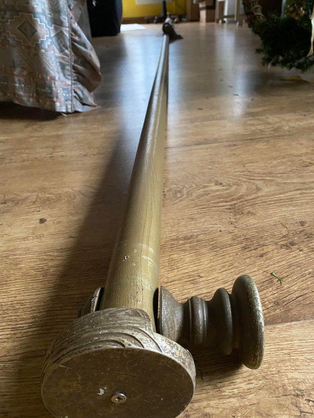 Preview of the first image of Wooden curtain pole, fittings and 63 rings..