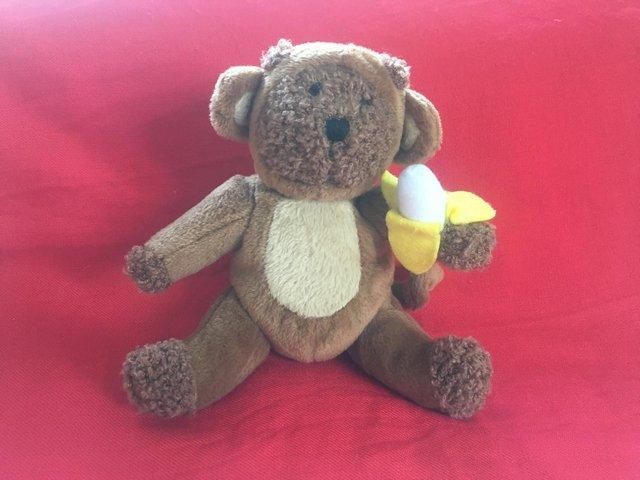 Preview of the first image of Cute baby GAP soft/plush brown monkey holding banana.