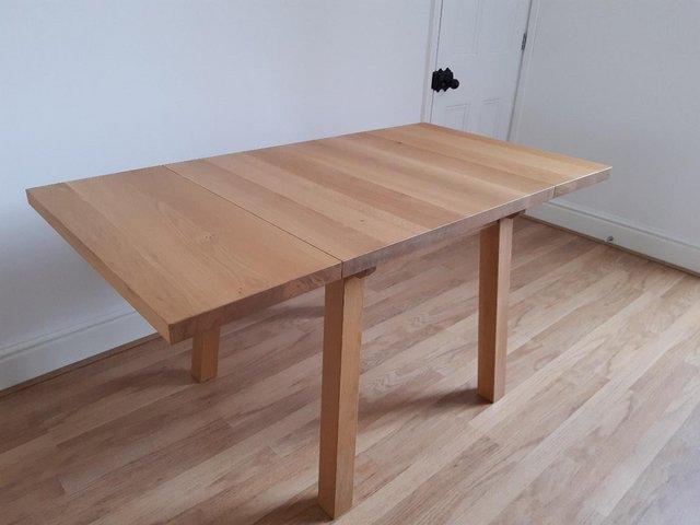 Preview of the first image of Oak dining table - drop leaf/extending.
